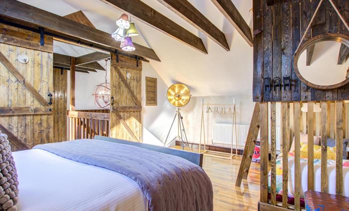 Large family room with double bed and bunk bed